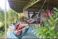 Hammocks On Patio Of Main Building Surf Vista Villas
 - Costa Rica