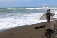        dominical beach attraction surfer 
  - Costa Rica
