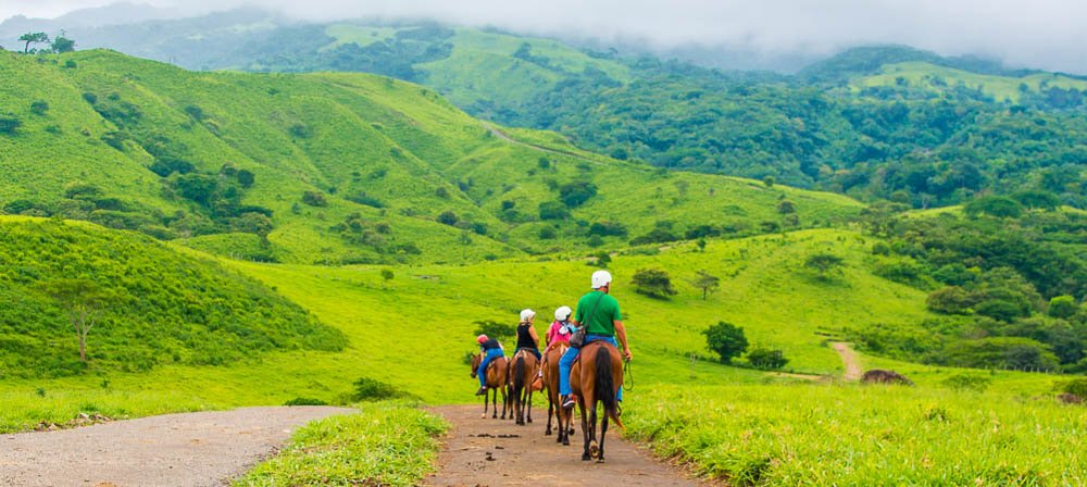 group descending to tizati river valley horseback ride tour western side of rincon de la vieja volcano
 - Costa Rica